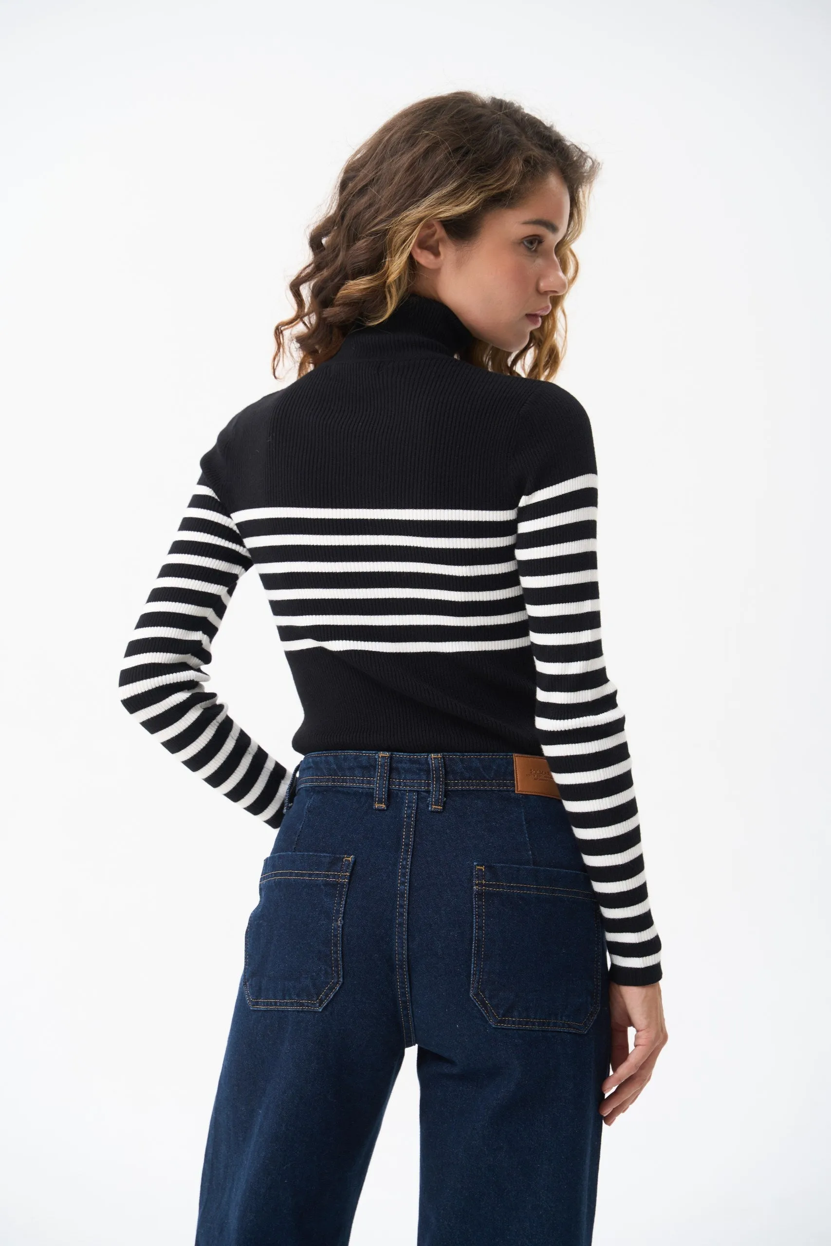 Black turtleneck sweater with a milky stripe